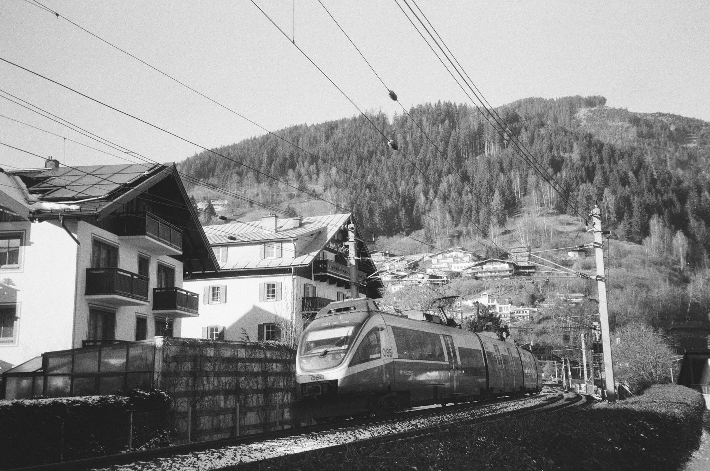 Nikon Zoom 500, Kentmere Pan 200 — timed for the train crossing the frame.